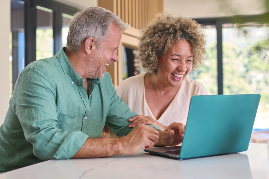 A couple studying UK retirement savings gap vs required pension income graph
